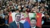 Government supporters hold a banner of Serbian President Aleksandar Vucic (left) and Chinese President Xi Jinping at a demonstration outside parliament in Belgrade in May 2020.