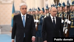 Kazakh President Qasym-Zhomart Toqaev and Russian President Vladimir Putin review troops after Putin arrived for a state visit on November 27.