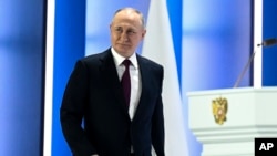 Russian President Vladimir Putin arrives to deliver his annual state-of the-nation address in Moscow on February 21.