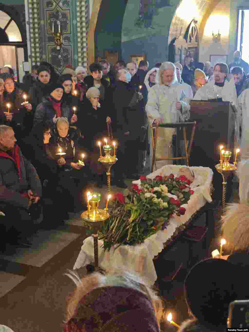 Family and friends gathered around Navalny&#39;s open casket. The general public was not allowed to file past the coffin, which is the custom at large Orthodox funerals.