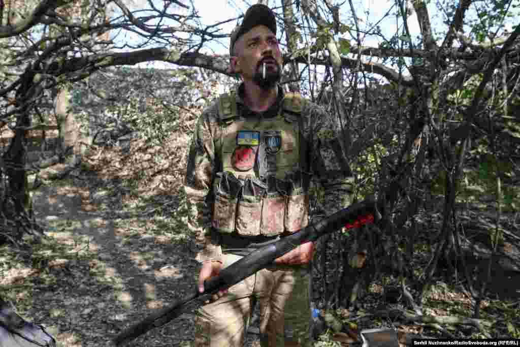 Artem readies a shotgun as a drone is heard overhead in early October. As of October 8, Russian forces are around 6 kilometers from Pokrovsk and appear to be focusing their entire war efforts in Donetsk on capturing the city. &nbsp;