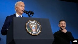 U.S. President Joe Biden and his Ukrainian counterpart, Volodymyr Zelenskiy, attend a Ukraine Compact event on the sidelines of the NATO Summit in Washington on July 11. 