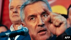 Montenegrin Prime Minister Milo Djukanovic and leader of ruling Democratic Party of Socialists speaks to his supporters after parliamentary elections in Podgorica on October 17.