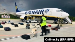 Security checks passengers' luggage after Raman Pratasevich's Ryanair flight was forced to land in Minsk in May 2021.