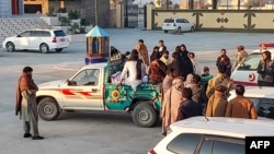 Relatives transport the body of a victim of sectarian attacks in the Kurram district of Pakistan's Khyber Pakhtunkhwa Province. 