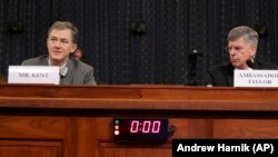 George Kent (left), the deputy assistant secretary of state for European and Eurasian affairs, and William Taylor, the U.S. charge d’affaires in Ukraine, testify before the House Intelligence Committee on November 13.