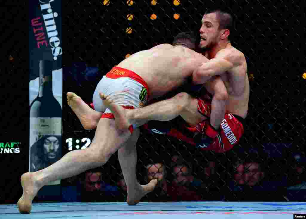 Georgia&#39;s&nbsp;Merab Dvalishvili&nbsp;(left) tackles Russian fighter Umar Nurmagomedov during their UFC 311 bout in California&#39;s Intuit Dome on January 18. Dvalishvili retained his bantamweight title by unanimous decision.&nbsp;