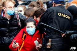 Riot police detained striking students in Minsk on October 26.