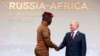 Burkina Faso interim leader Ibrahim Traore (left) shakes hands with Russian President Vladimir Putin during the Russia-Africa Summit in Russia last year. 