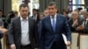 The new prime minister of Kyrgyzstan, Sadyr Japarov (left), and the former president, Sooronbai Jeenbekov, in Bishkek on October 16