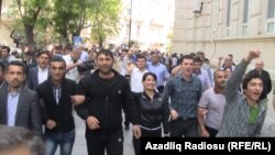 Some 100 opposition activists turned out for the unauthorized demonstration in Baku. 