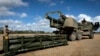 Soldiers prepare to load an Army Tactical Missile System (ATACMS) onto a High Mobility Artillery Rocket System (HIMARS). (file photo)