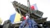 A Romanian soldier guards a Patriot missile system. (file photo)