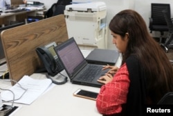 An employee works on a computer at the office of the Pakistan Freelancers Association, a platform and support group to help independent workers in Karachi, Pakistan. (file photo)