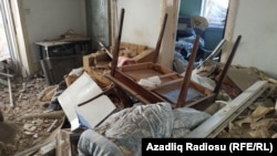 Debris fills a home in the Azerbaijani city of Ganca that was struck by a rocket fired from Armenia on October 11. Both sides suffered military and civilian losses after fighting erupted in September over the breakaway region of Nagorno-Karabakh. (Azadliq Radiosu, RFE/RL)