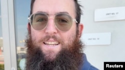 Zvi Kogan, an Israeli rabbi, stands outside a supermarket, in Dubai