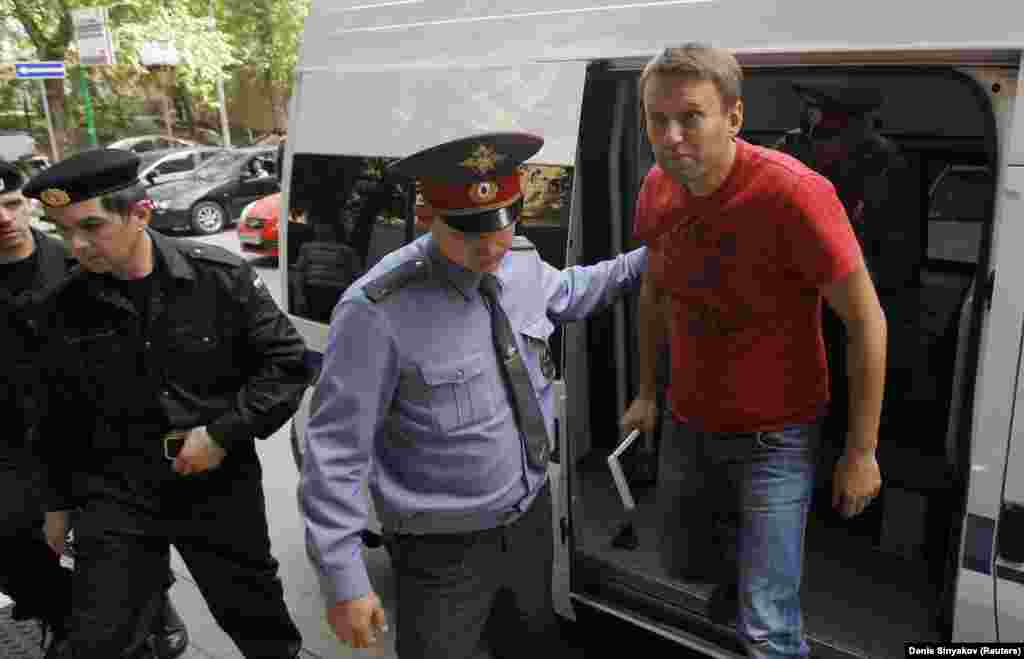 Navalny is escorted to a court session in Moscow in May 2012. He was detained during an opposition rally a day after the May 7 inauguration of Putin. Navalny was sentenced to another 15 days of jail for &quot;participating in an illegal public event.&quot;