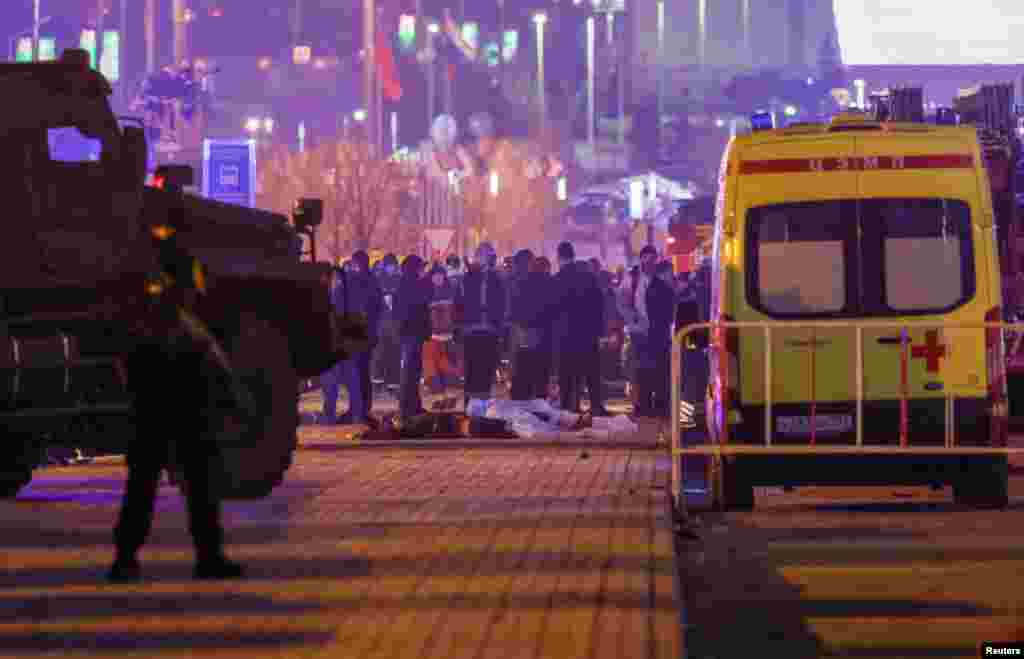 The bodies of victims are seen outside the Crocus City Hall concert venue following the shooting.