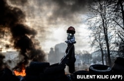 A scarecrow-like mock protester is seen on a barricade on February 21.