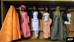 It seems these Barbie dolls wearing cultural clothes from around the world would not be welcome in Tajikistan, which is seeking to promote the country's traditional dress. (file photo)