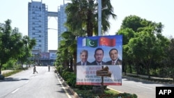 Signs mark the arrival of Chinese Prime Minister Li Qiang in Islamabad as the city is put under security lockdown to host a meeting for the Shanghai Cooperation Organization. 