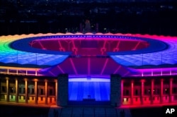 The Olympic Stadium in Berlin is lit up in rainbow colors during the Euro 2020 soccer match between Germany and Hungary on June 23, 2021.