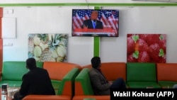 Customers watch a live broadcast of Donald Trump at a juice shop in Kabul. (file photo)