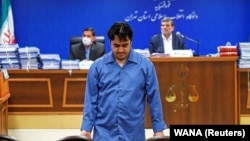 Ruhollah Zam, a dissident journalist who was captured in what Tehran called an intelligence operation, is seen during his trial in Tehran in June.