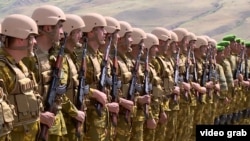 Tajik troops in the volatile Shamsiddin Shohin district bordering Afghanistan (file photo) 