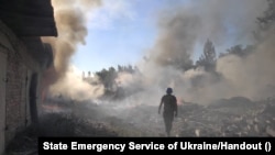 A rescuer walks among debris at the site of a residential area destroyed by a Russian military strike, in the town of Toretsk in Ukraine's Donetsk region on July 27.