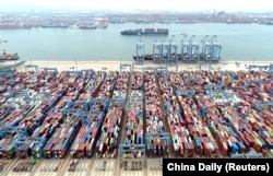 Containers and cargo vessels at the Qingdao port in China’s Shandong Province in May.