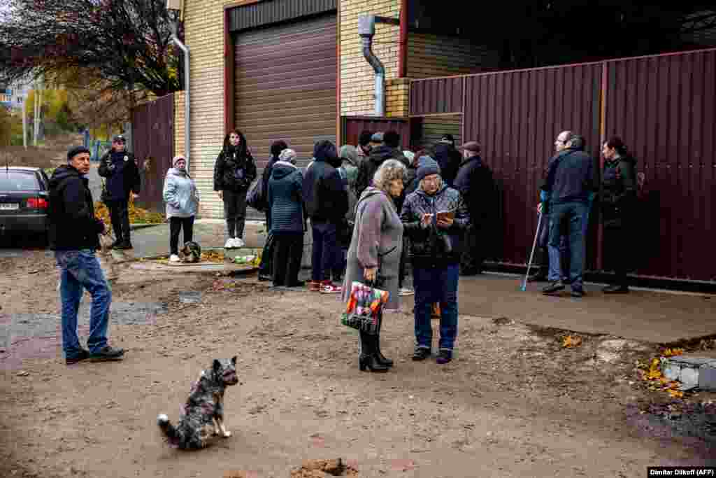 People wait to submit their DNA to identify their deceased relatives in the town of Izyum, in Ukraine&#39;s northeastern Kharkiv region, on November 4. &nbsp;