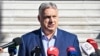 Hungarian Prime Minister Viktor Orban addresses journalists in front of a polling station in Budapest on June 9.