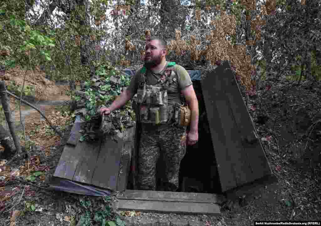 Yuriy, a 40-year-old who volunteered to fight the day after Russia&#39;s full-scale invasion on February 24, 2022, emerges from his bunker to offer hot coffee during a brief lull in the fighting.