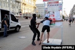 A protester is detained on Independence Avenue in Minsk on the eve of the election on August 8.