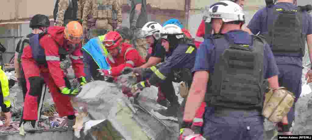 Rescuers removing rubble after the strike.&nbsp; Local authorities told media that &quot;people are under the rubble&quot; as rescue work was continuing.&nbsp;