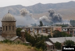 Smoke is seen over buildings after a Russian bombardment of Gori, 80 kilometers from Tbilisi, on August 9, 2008.