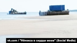 "This is what death looks like": What appears to be a damaged blue shipping container, the kind that often appear in Defense Ministry promotional materials about missile launches, is shown in a photograph taken from a closed chat room on the Russian social media platform VK.