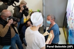 A medical worker administers a dose of Sputnik V in Moscow on April 7. The vaccine was heralded as a success, even though it hadn’t undergone the typical three-phrase process of clinical tests.