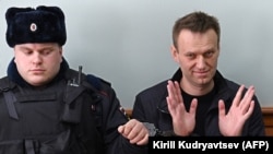 Kremlin critic Aleksei Navalny (right) has been jailed several times in recent years by Russian authorities. 