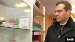 A stiff-looking Medvedev visits a maternity hospital in Volkhovets in 2007.