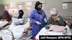 Afghan mothers of newborn babies get treatment at the Rezaei Maternity Hospital in Herat.