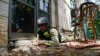 An Israeli firefighter takes cover in Kiryat Shmona, an evacuated city in northern Israel that frequently comes under rocket attacks launched by Hezbollah militants across the border in Lebanon.