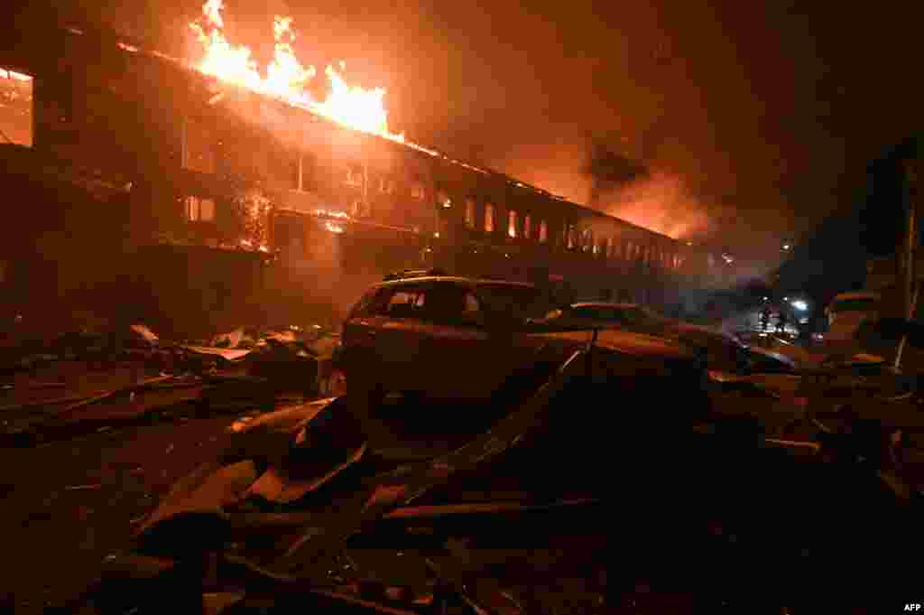 Ukrainian rescue workers battle a blaze in a building in Kyiv after a Russian drone strike on the city on January 28.&nbsp;