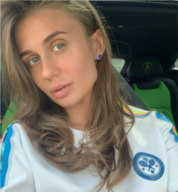 Alyona Benderskaya behind the wheel of a Lamboghini