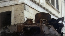 A Russian armored vehicle "684" with the remains of a soldier