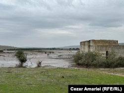 Floods in Galati flow past part of the unfinished Suhurlui Dam.