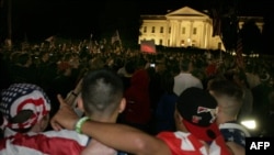 People celebrate the announcement of the death of Osama bin Laden at the White House in Washington.