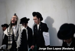 Members of Lev Tahor pray in the village in Guatemala where they lived in 2014.