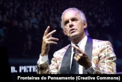 Jordan Peterson wears a Toukhcher-designed suit at an event in Brazil in June 2024.